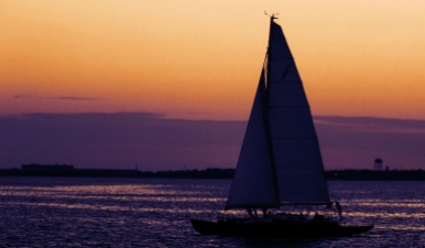Sunset And Sailboat